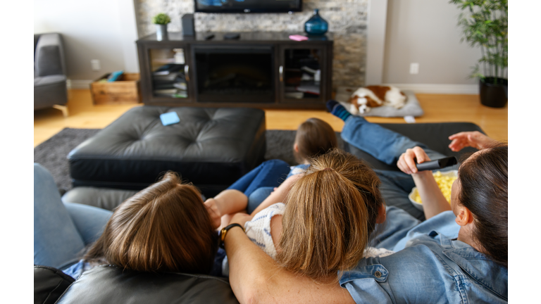 Family watching tv and using internet