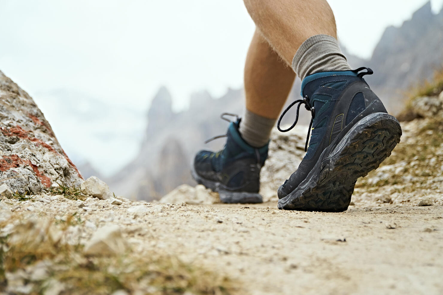 Hiker on dirt track, Canazei, Trentino-Alto Adige, Italy
