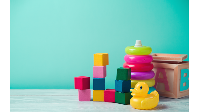 Baby toys on wooden table