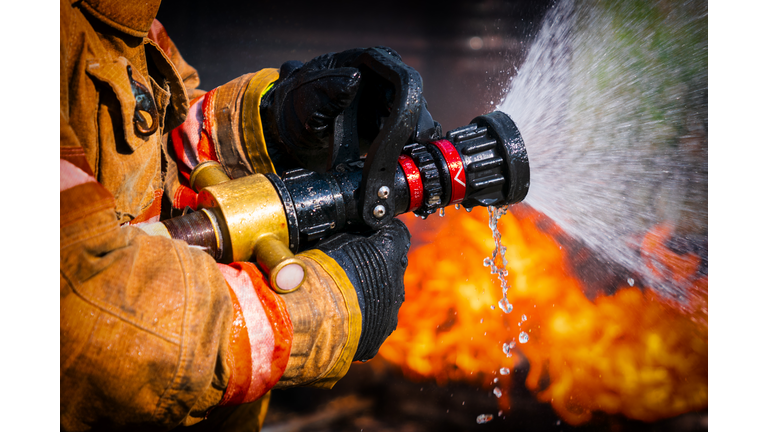 Firefighters Extinguishing House Fire.