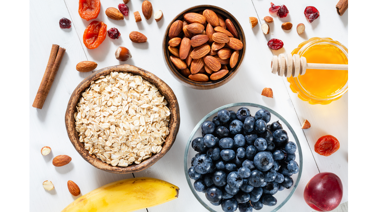 Oatmeal, blueberries, almonds and honey for cooking breakfast porridge