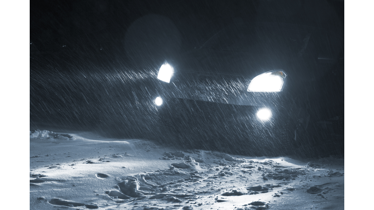 Car driving in a Snowstorm