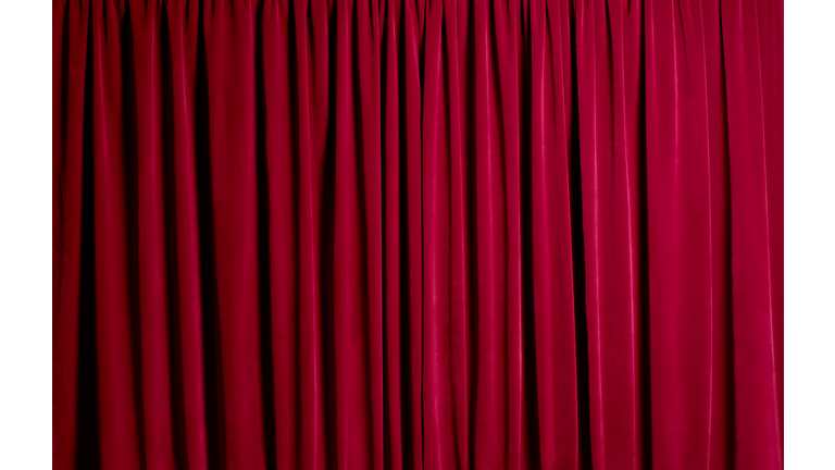 Closed red theatre curtains
