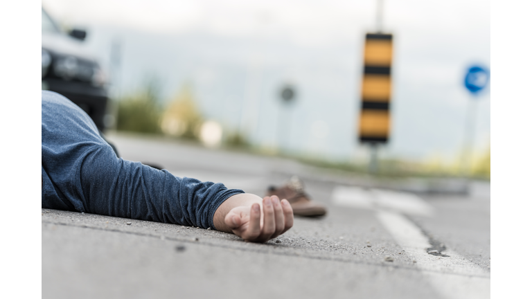 Traffic accident.Young man hit by a car