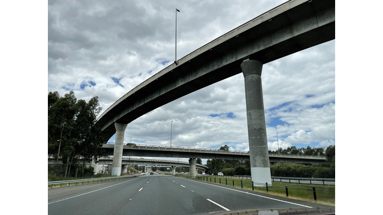 Main road highway, motorway interchange overpass, no traffic, overcast sky