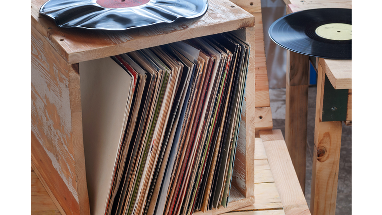 Vinyl record with copy space in front of a collection