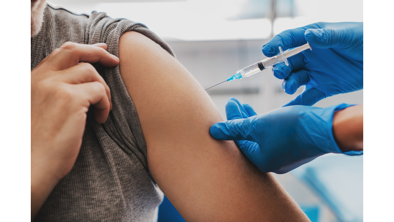 Vaccination of senior person in hospital