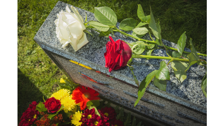 White And Red Rose On Tombstone