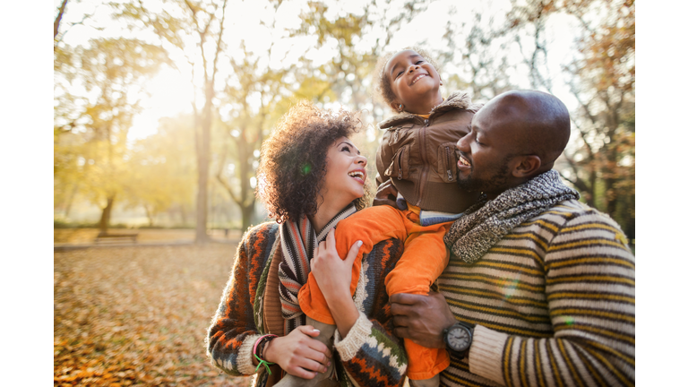 Playful African American couple enjoying a day in nature.