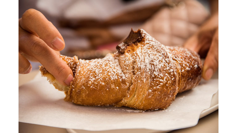 Eating a Sicilian chocolate croissant