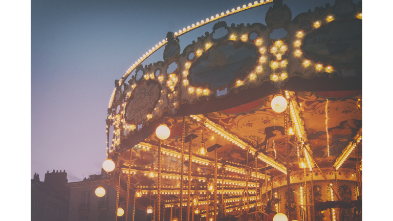 Top part of a carousel at evening