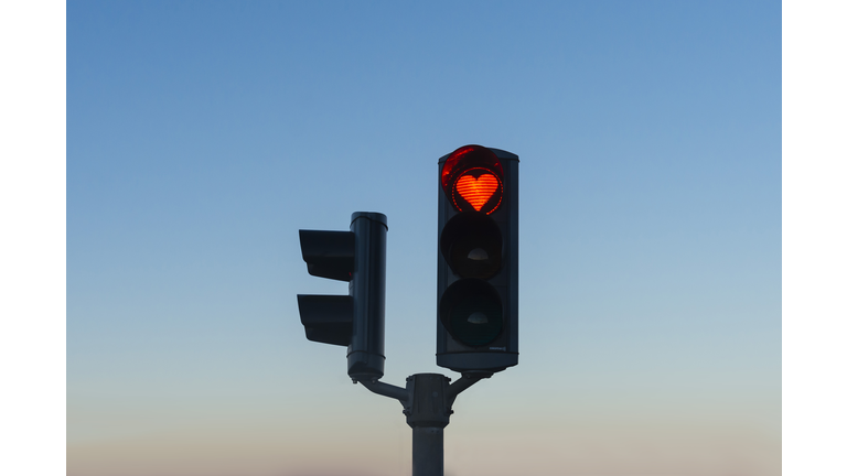 Heart-shaped red stop traffic light in Akureyri, Iceland