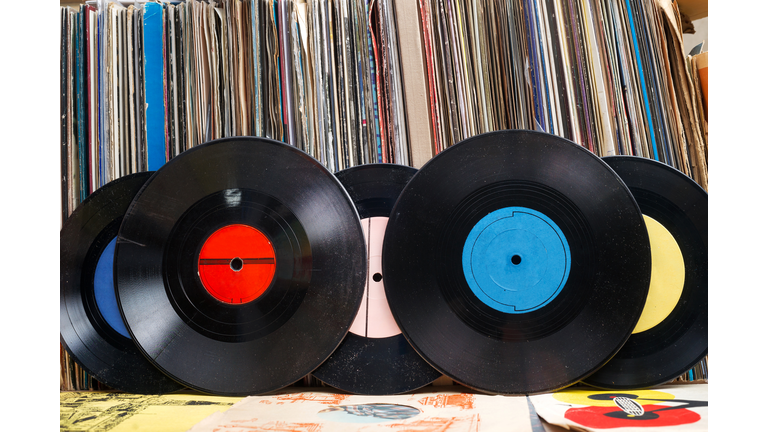 Vinyl record with copy space in front of a collection