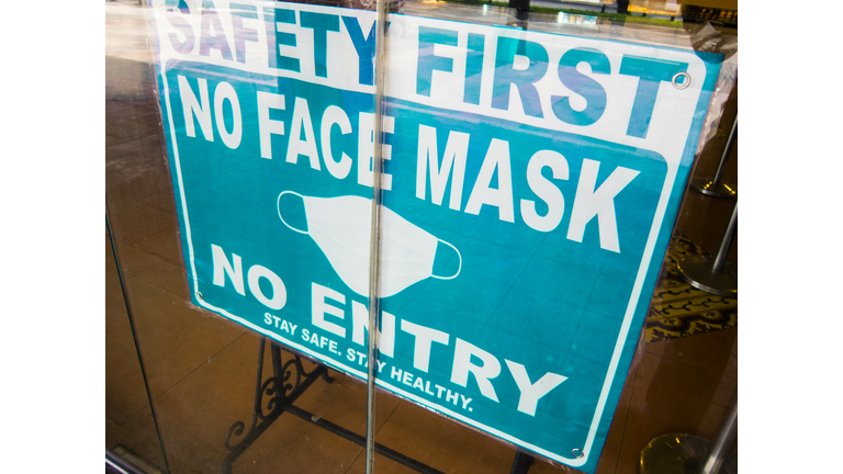 No Mask No Entry sign in a store window
