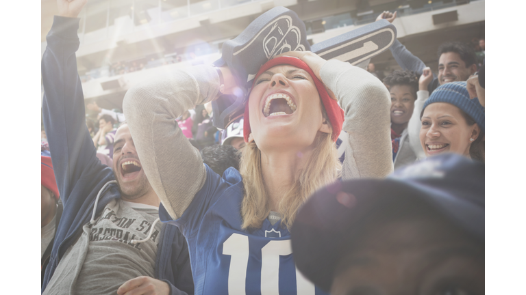 Sports fan cheering in stadium