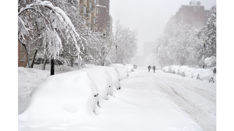 Block of snow-covered cars