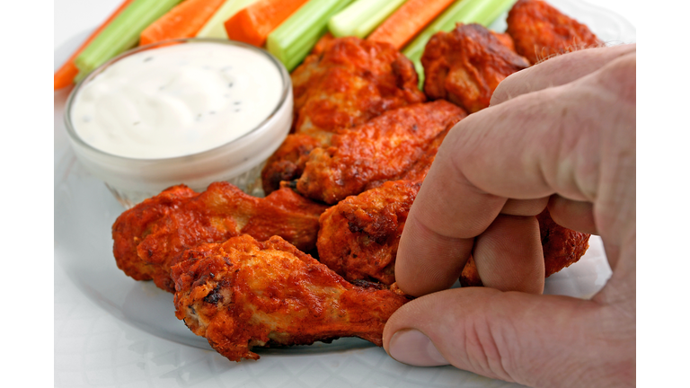 Buffalo chicken wing appetizer plate with blue cheese dipping sauce