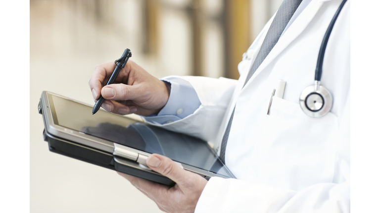 Doctor using a tablet PC