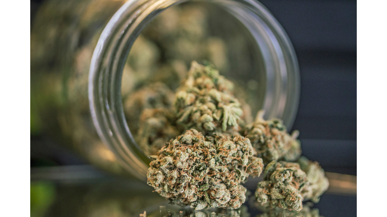 Close-Up Of Weed Porn In Mason Jar On Table