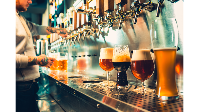 Glass of beer with barrel, bottle and fresh hops still-life
