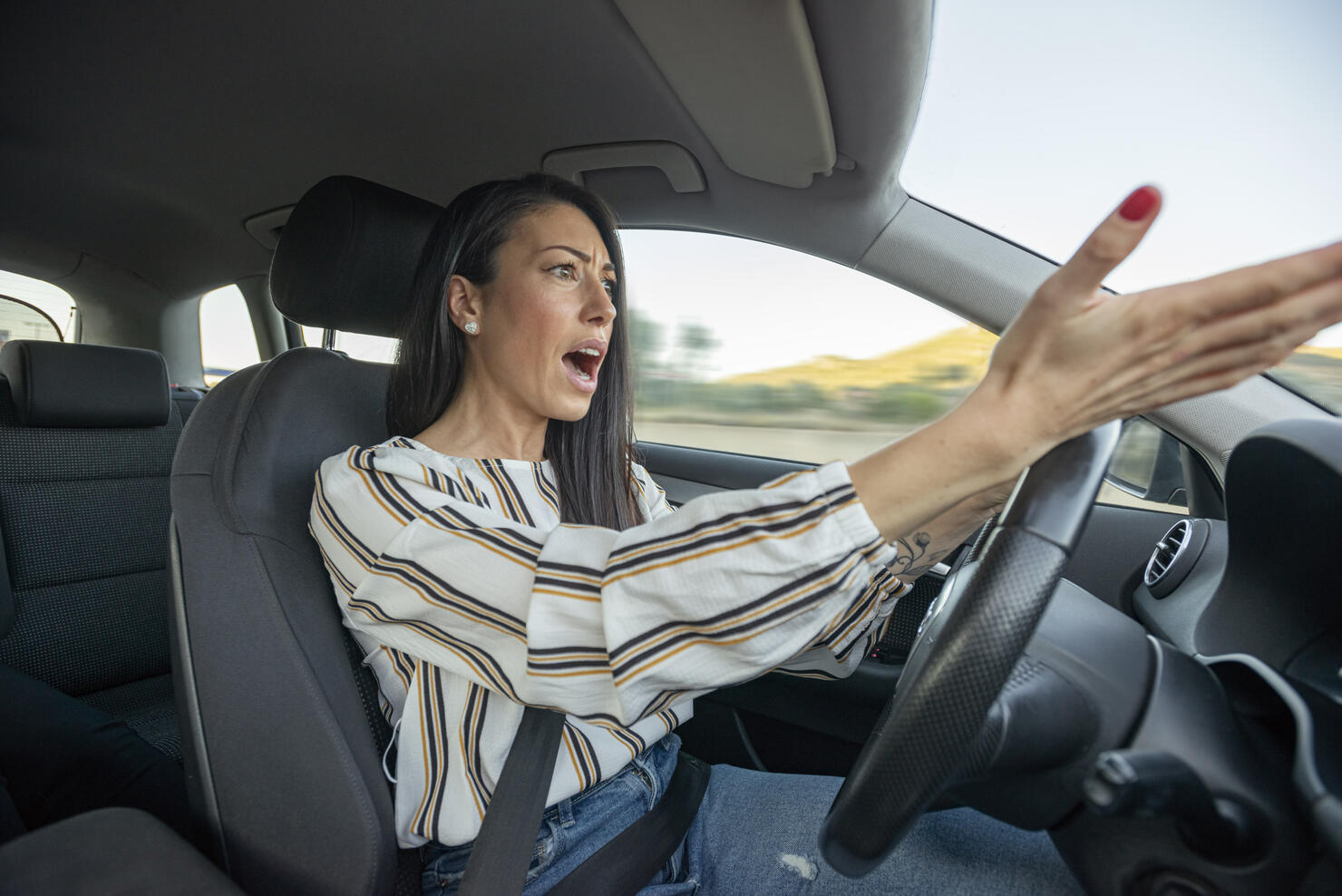 Frustrated Woman Driving Car
