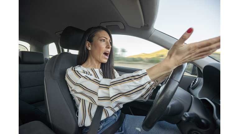 Frustrated Woman Driving Car