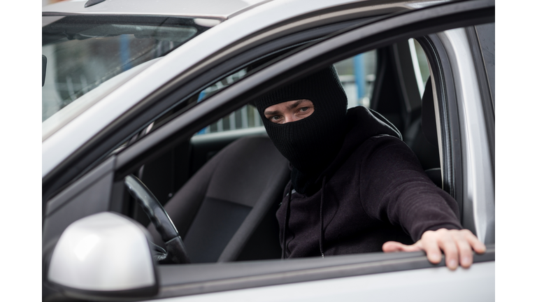 Car Thief gets into a stolen car