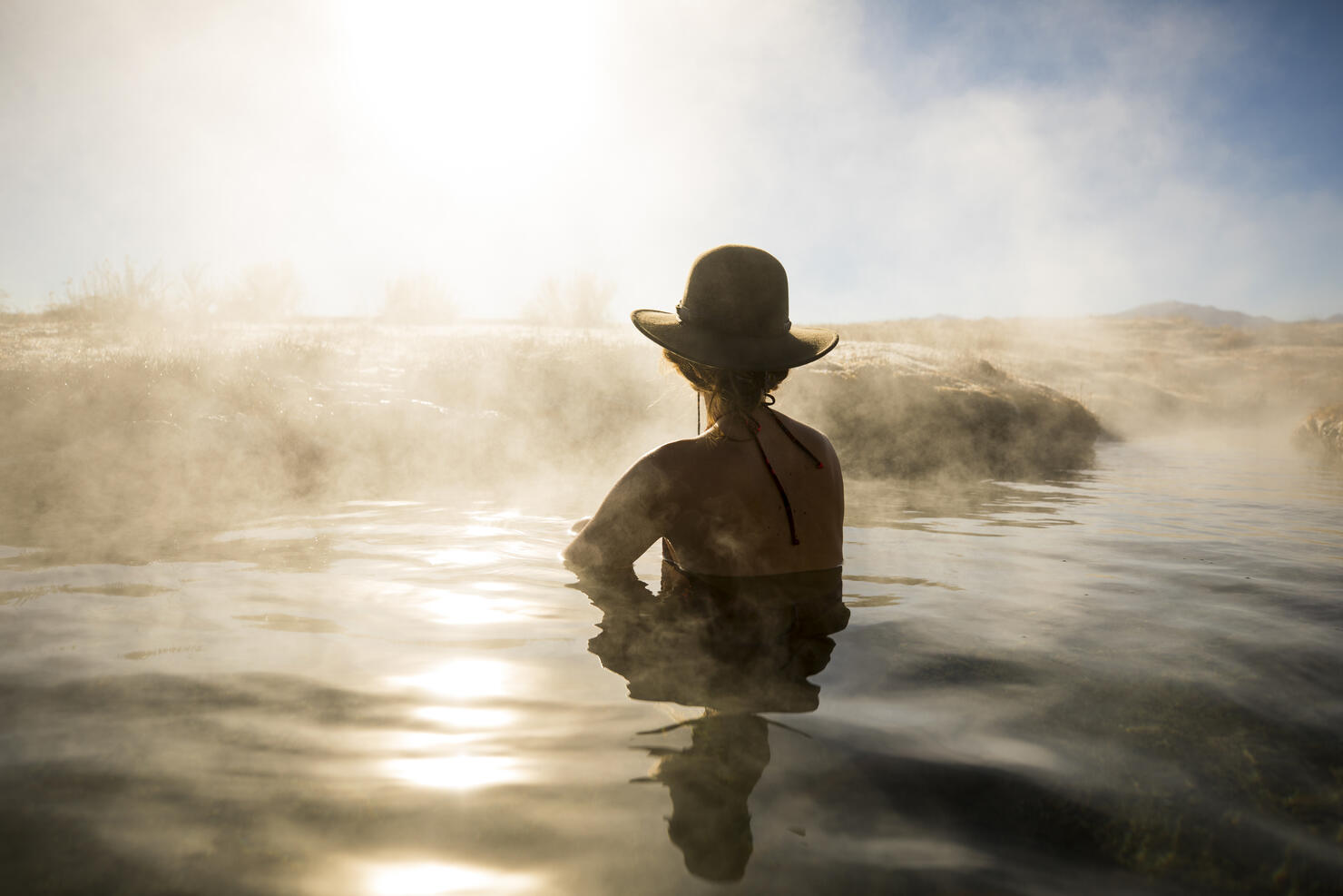 A woman relaxing in a hot spring.