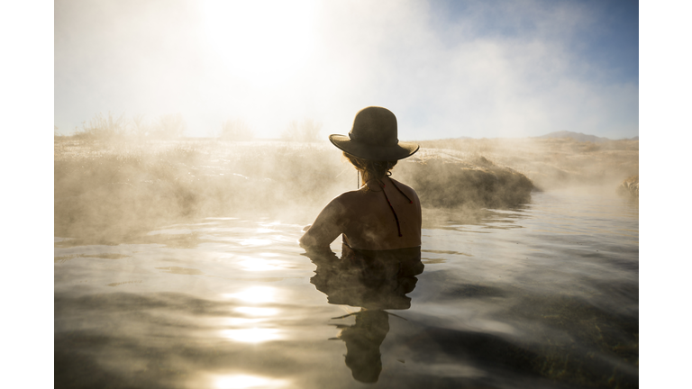 A woman relaxing in a hot spring.