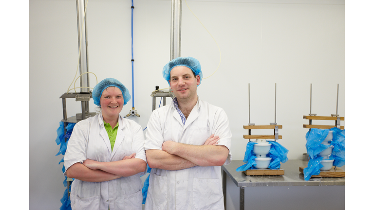 Workers in goats cheese production unit