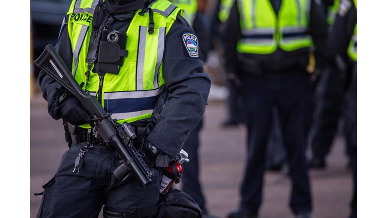 Riot policemen with gas gun