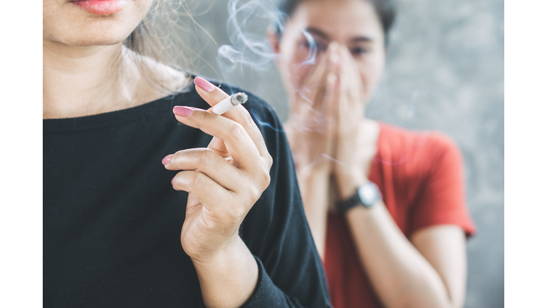 Woman Smoking Cigarette Indoors