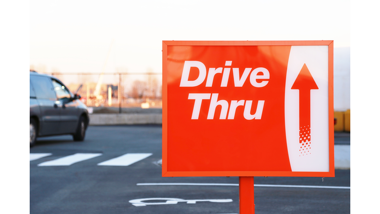 Red and white Drive Thru street sign