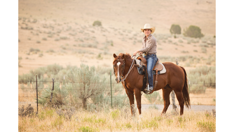 Cowgirl Riding Horse on Utah Ranch