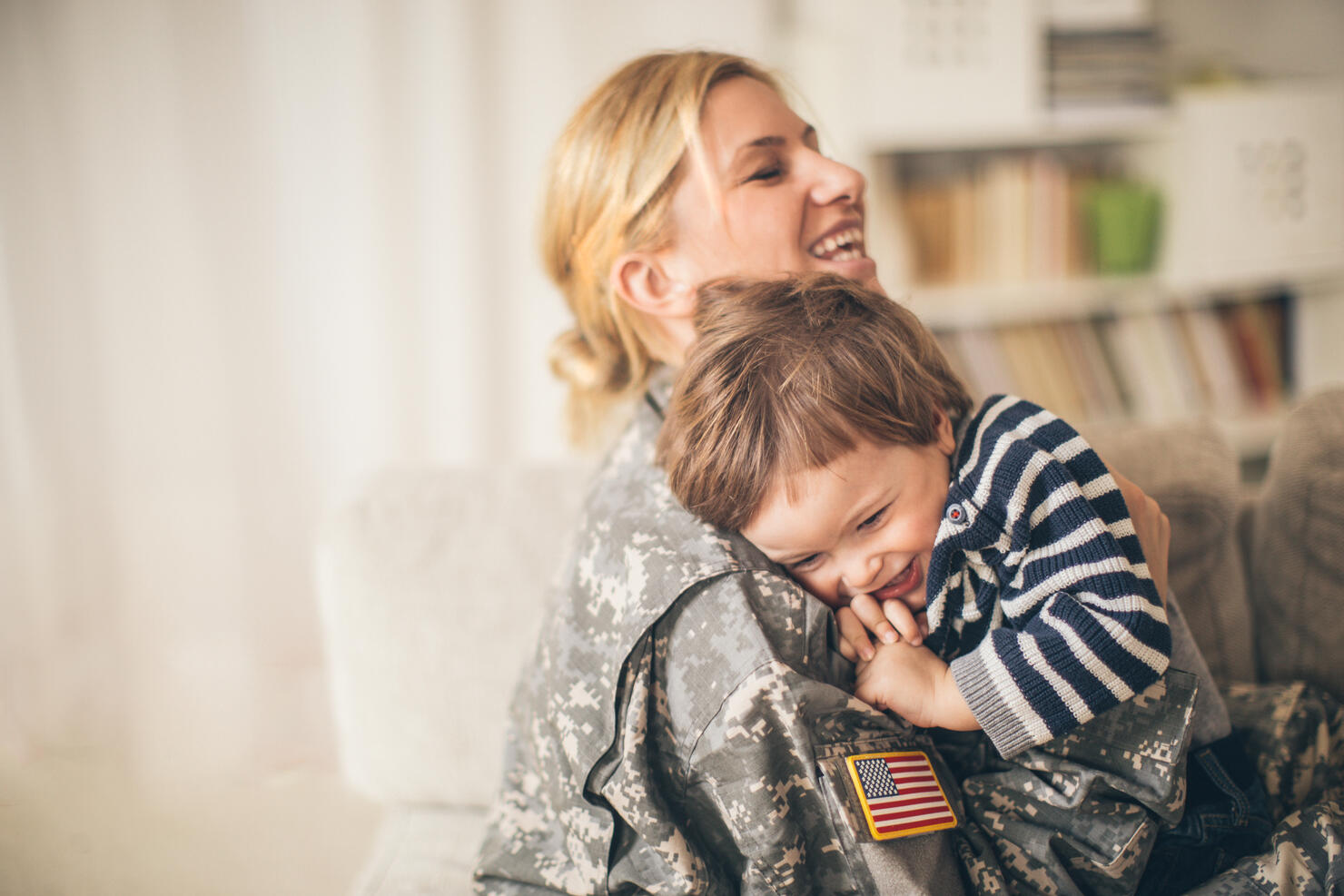Safe in mommy soldier's hug