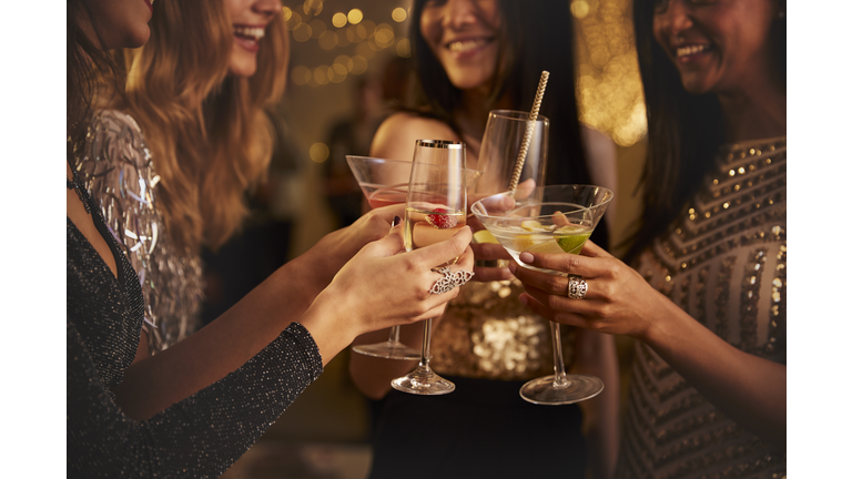 Female Friends Make Toast As They Celebrate At Party