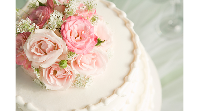 Roses on top of a wedding cake