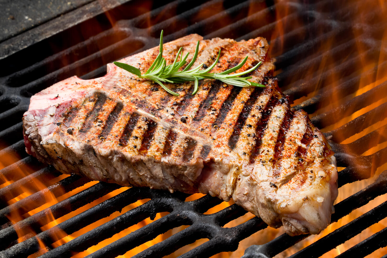 T-Bone Steak on Grill with Flames