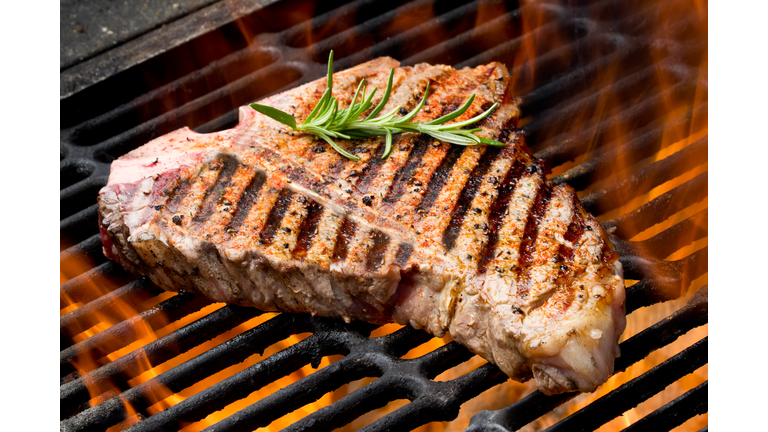 T-Bone Steak on Grill with Flames