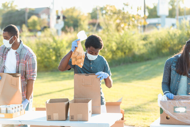Teenage boy volunteering during food drive