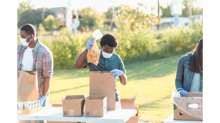 Teenage boy volunteering during food drive