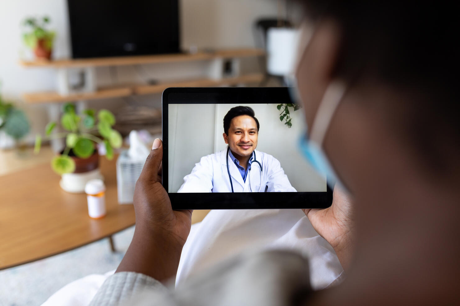 Sick woman having online consultation with doctor