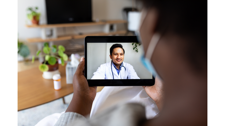 Sick woman having online consultation with doctor