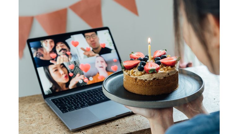 Young Woman Celebrating Birthday With Friends On A Video Call Using Laptop