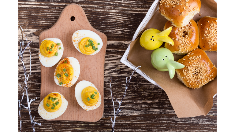 Deviled eggs and homemade buns on Easter table