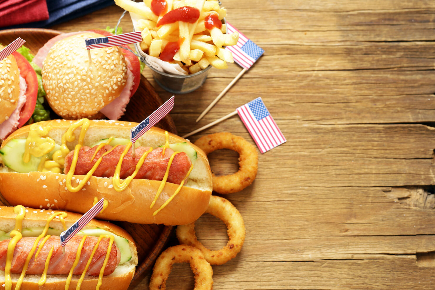 Traditional hot dog, french fries and onion rings food