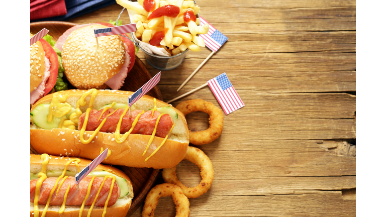 Traditional hot dog, french fries and onion rings food