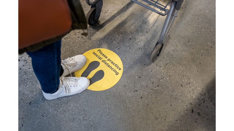 Social Distance Sign on the floor during COVID-19