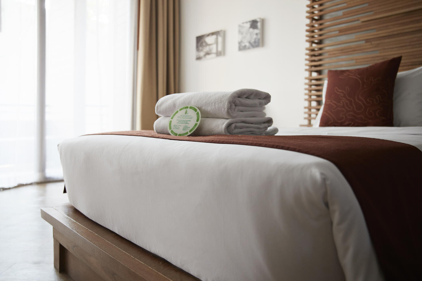 Towels on bed in hotel room