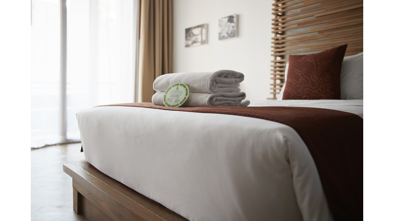 Towels on bed in hotel room